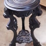 Antique carved side table with Indochinese inspiration, made of blackened wood