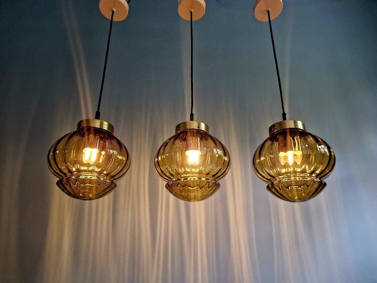 Set of 3 amber glass pendant lights, RAAK Amsterdam, 1970