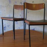 Pair of teak and iron stacking chairs, 1960s