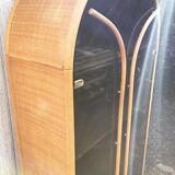 Curved bamboo and blond rattan library