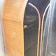 Curved bamboo and blond rattan library