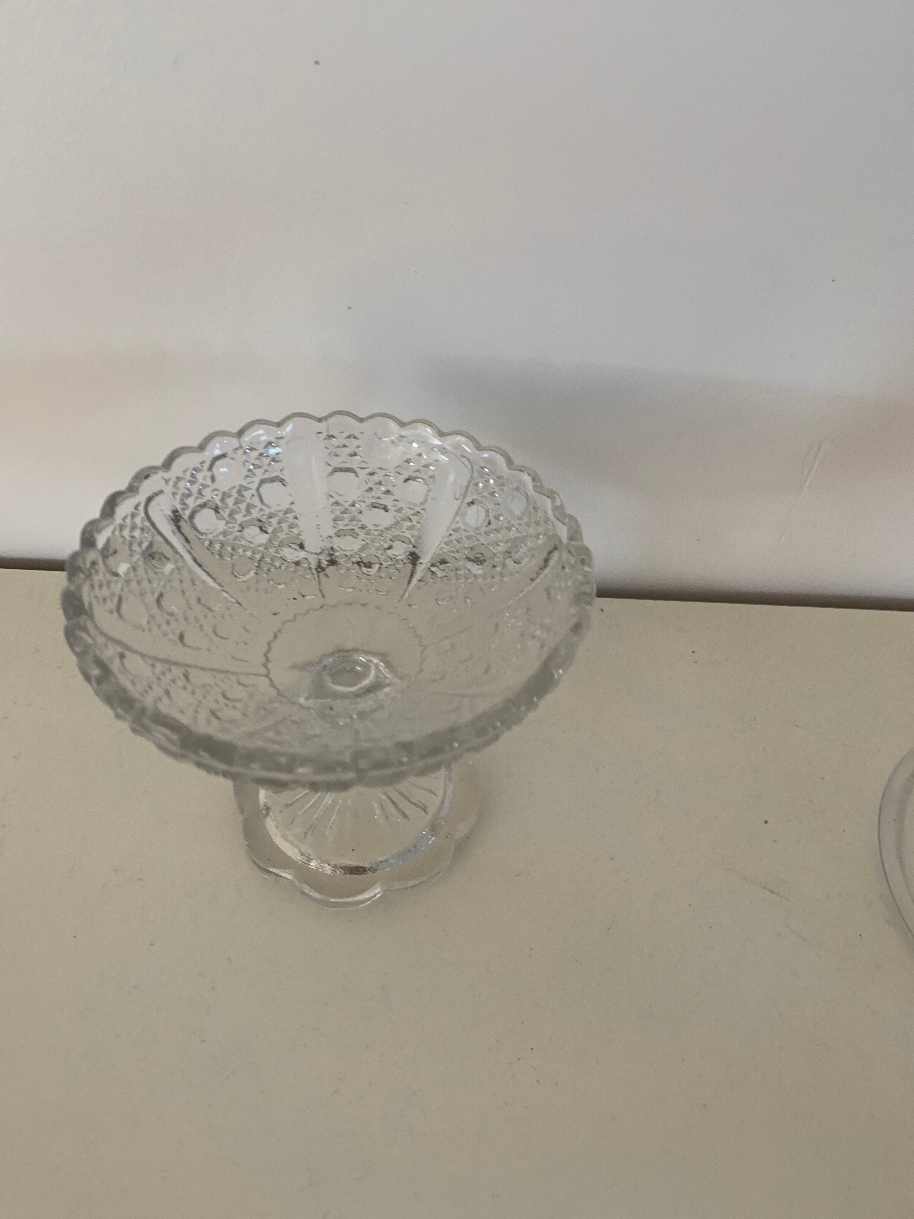 Two dredged cups in transparent glass geometric patterns in old relief