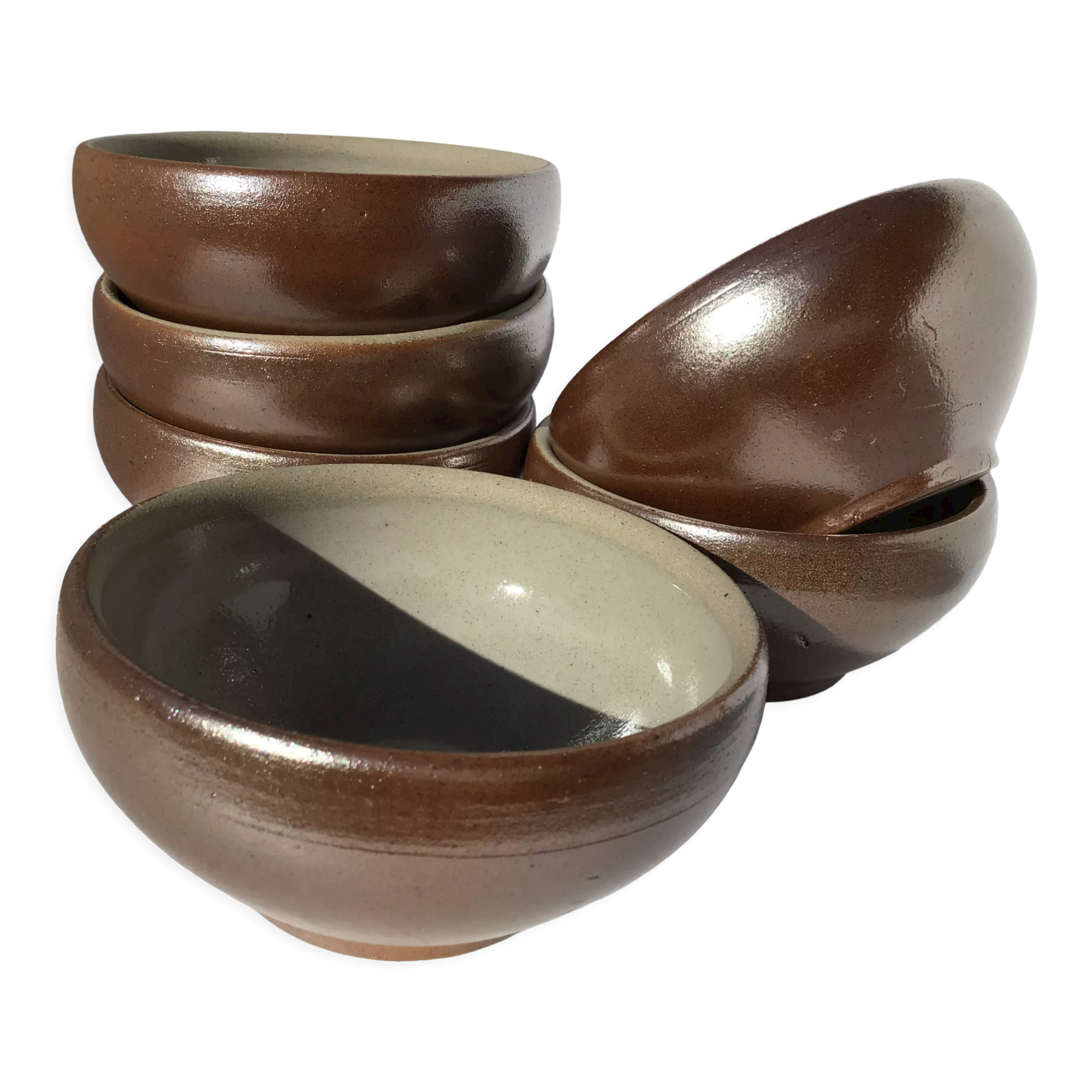 6 iridescent brown sandstone bowls inside grey