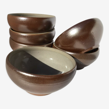 6 iridescent brown sandstone bowls inside grey