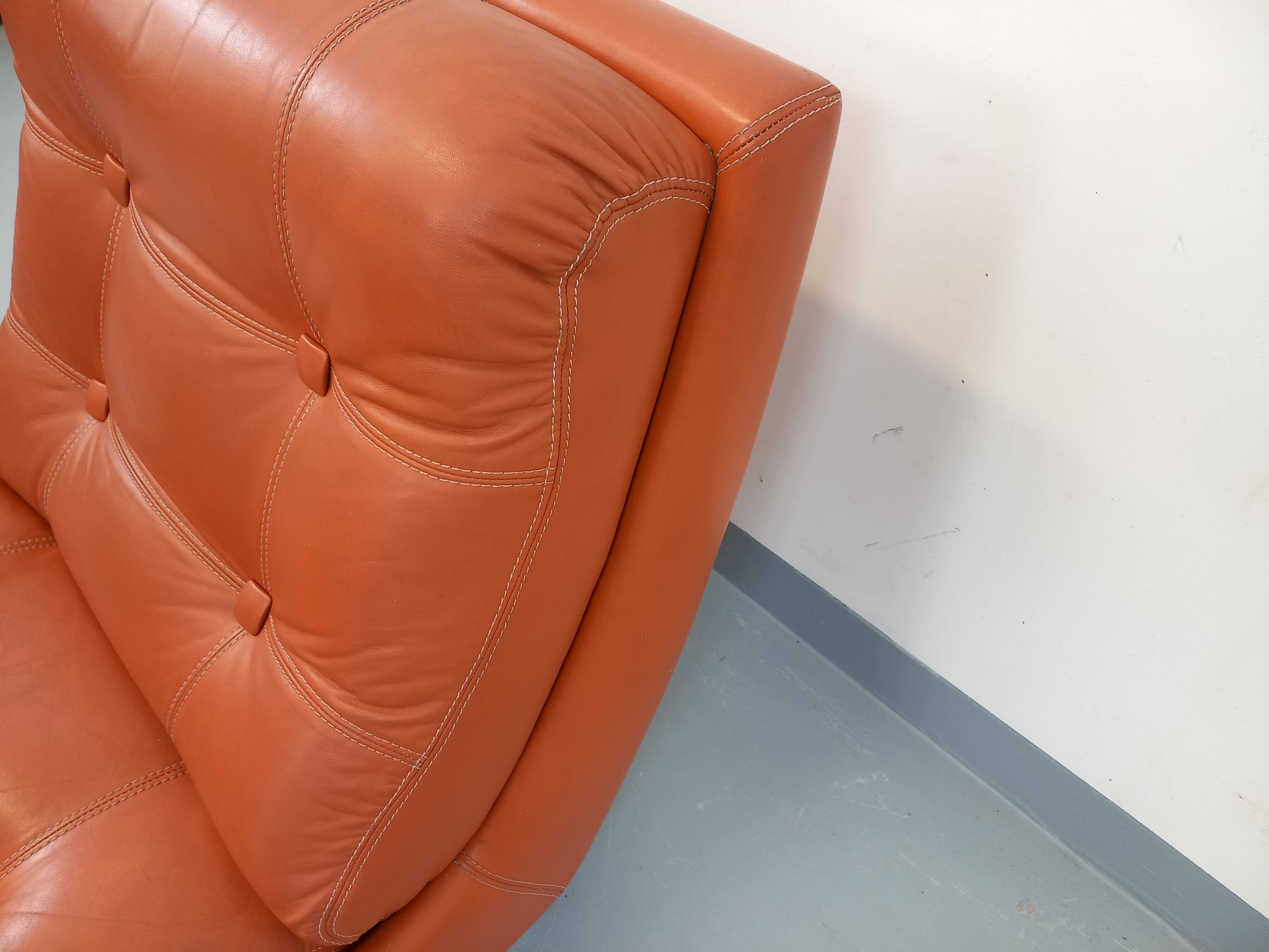 Vintage Roche Bobois armchair in chrome and terracotta leather.
