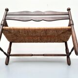Vintage bench with wooden backrest and structure and mulched seat