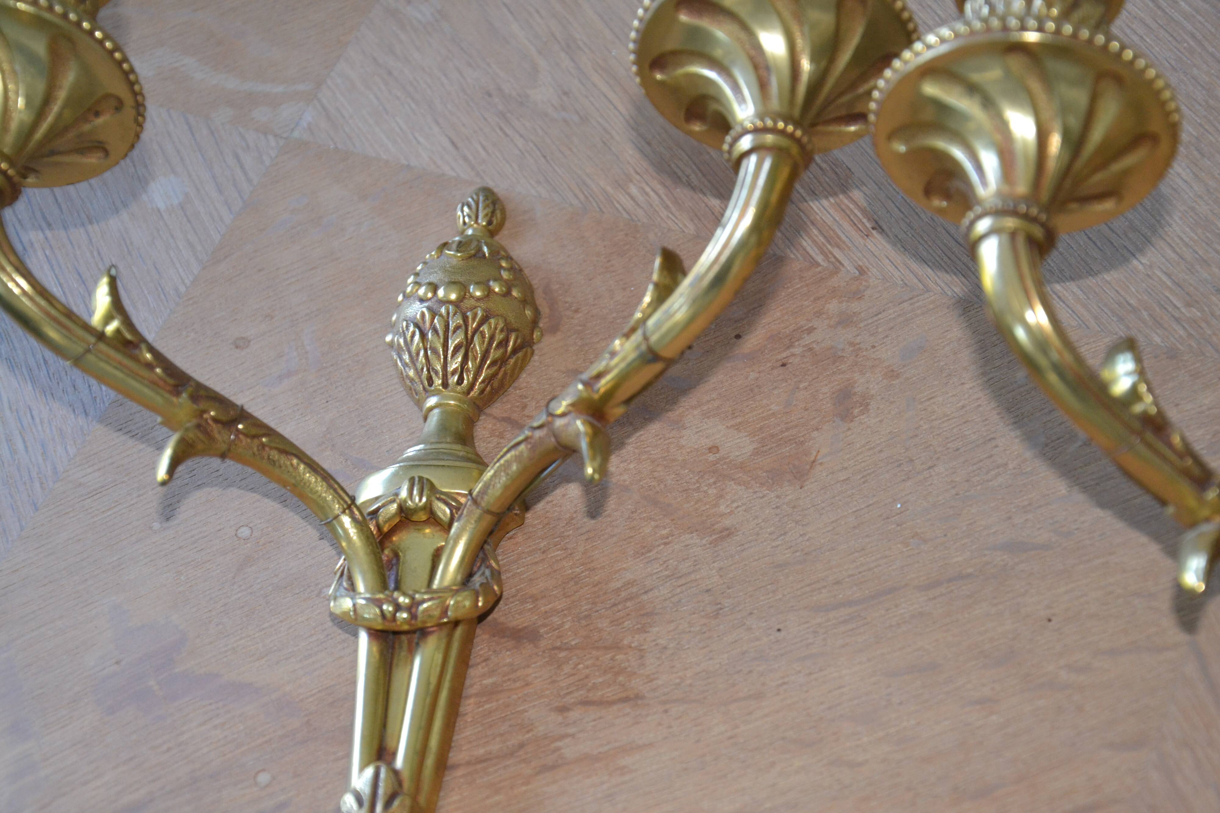 2 sculpted bronze wall lights