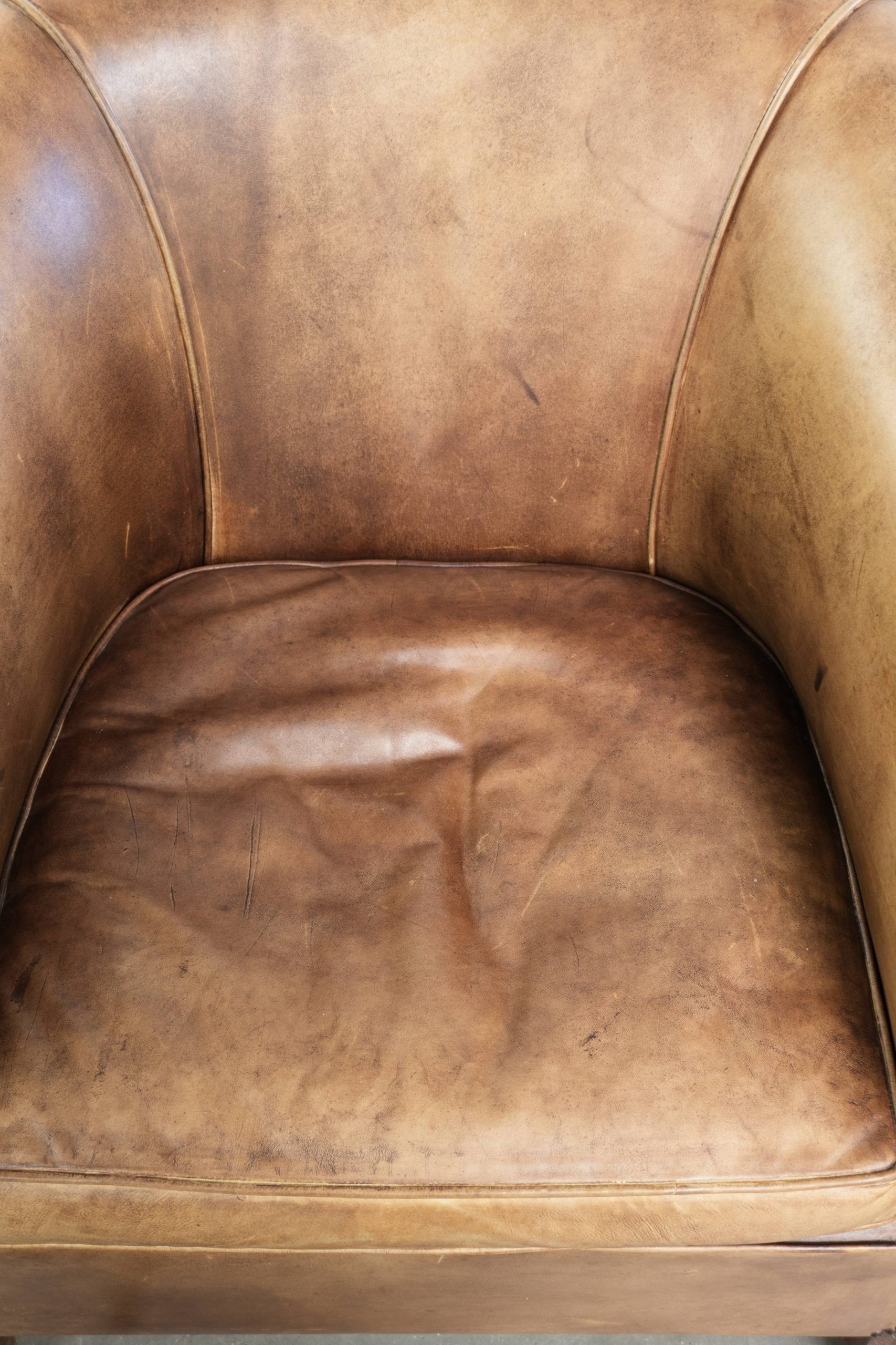 Set of two vintage cowhide club armchairs in English style