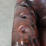 Set of two marbled cowhide leather Chesterfield armchairs in English style