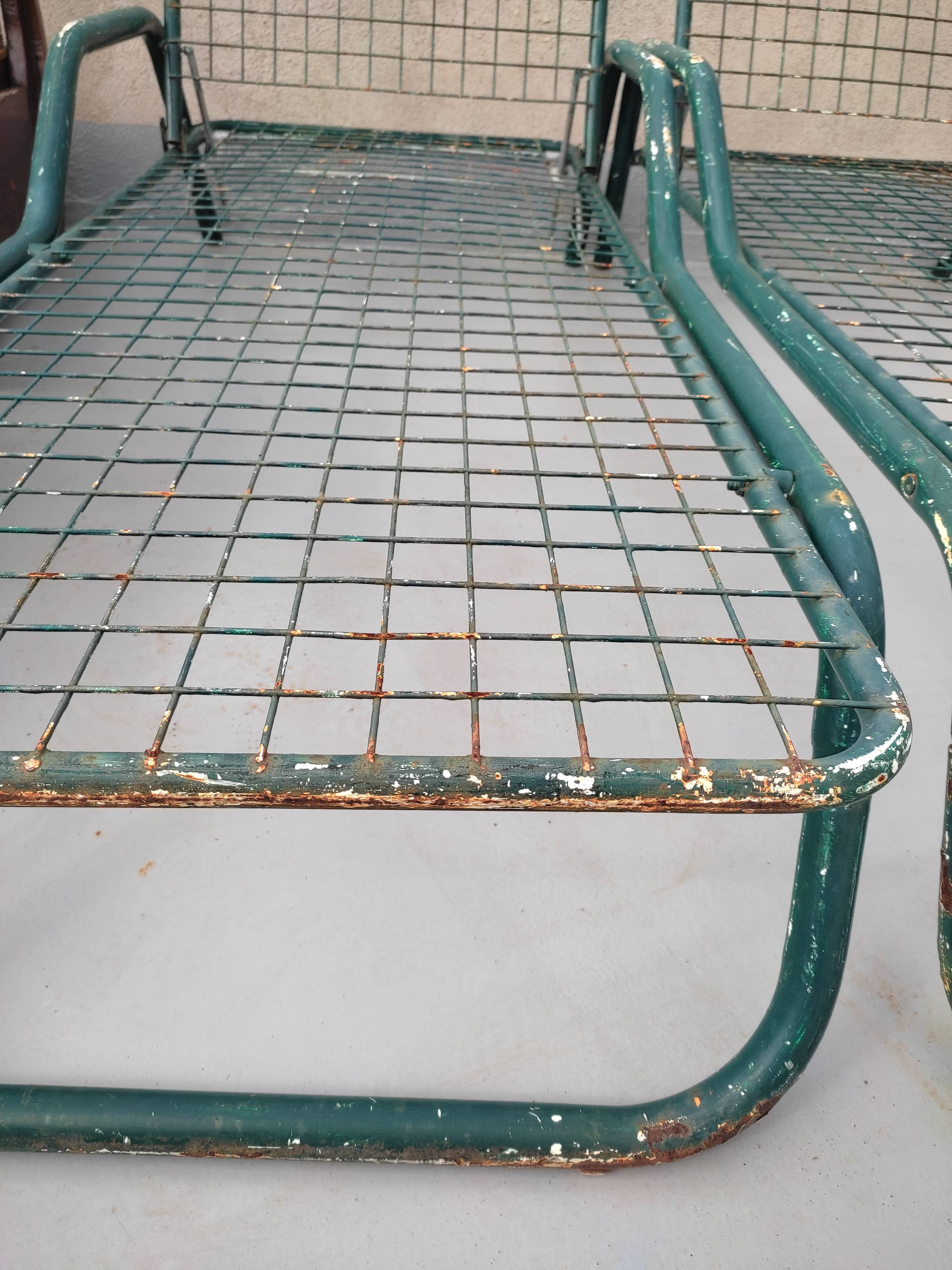 Pair of metal deckchairs