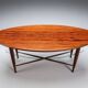 Assymetrical coffeetable with glass storage and cross leg details