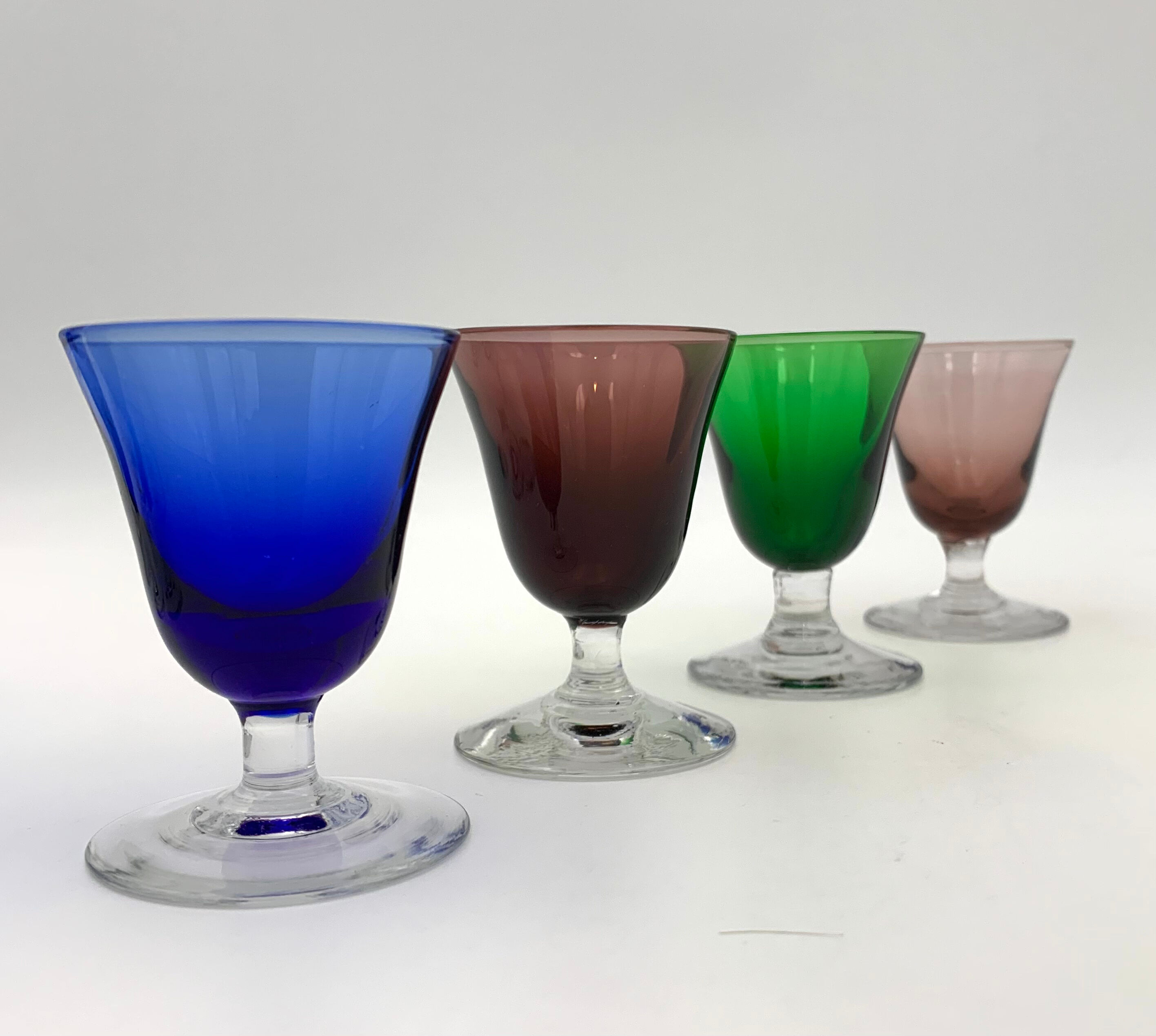 Nine vintage liquor glasses, coloured glass 20th century