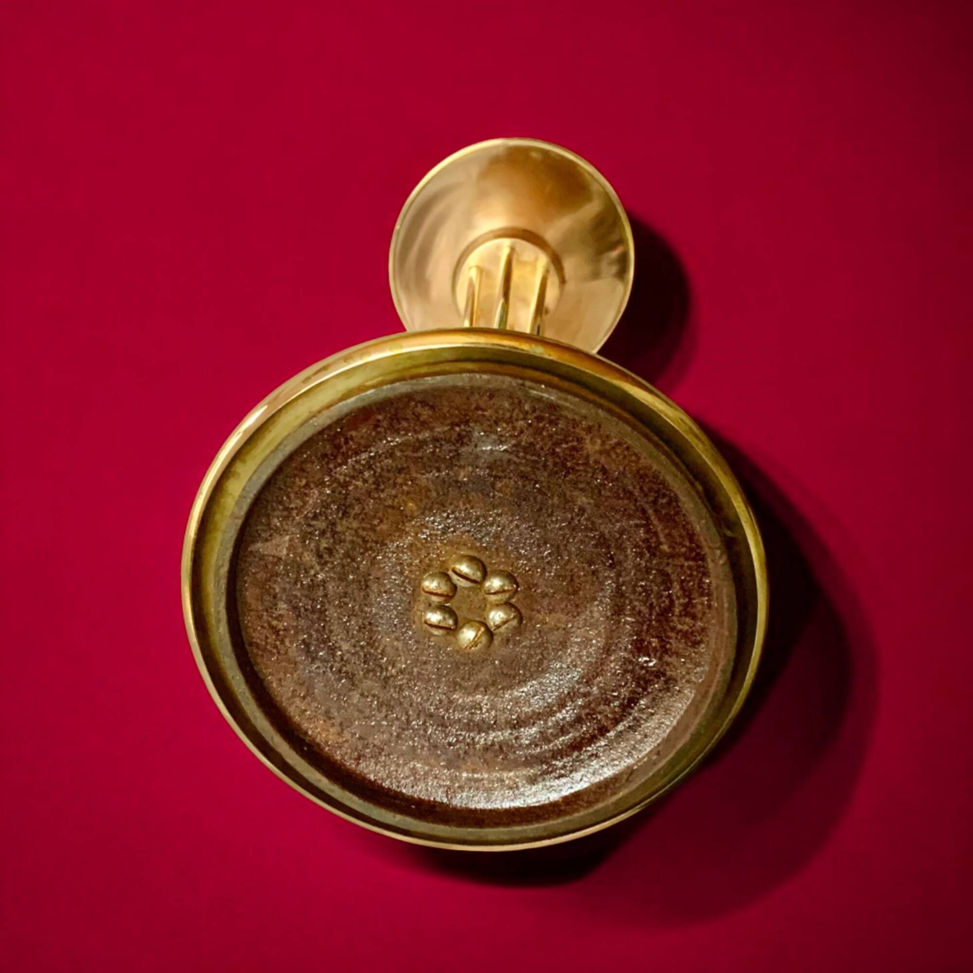 Old brass and chrome-plated metal ashtray on stand