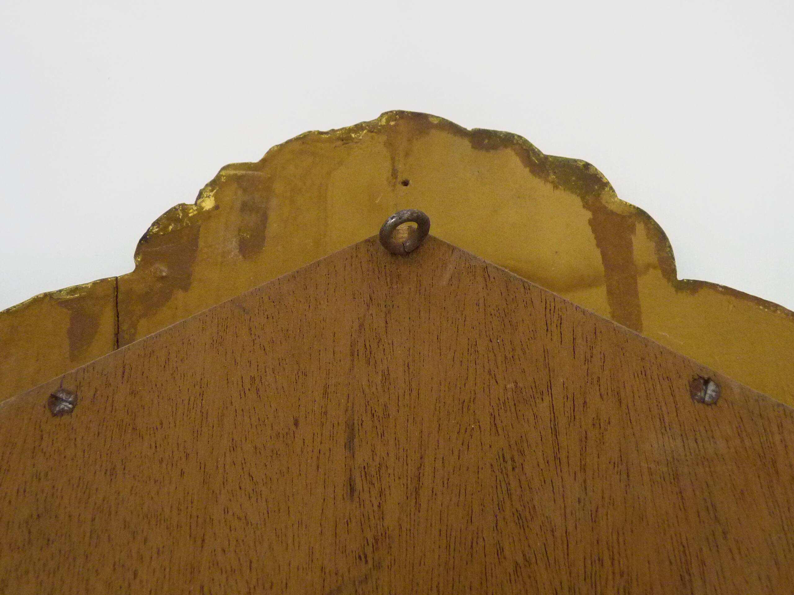 Old wall mirror in wood and gilded stucco with shell decoration, Louis XV style pediment mirror
