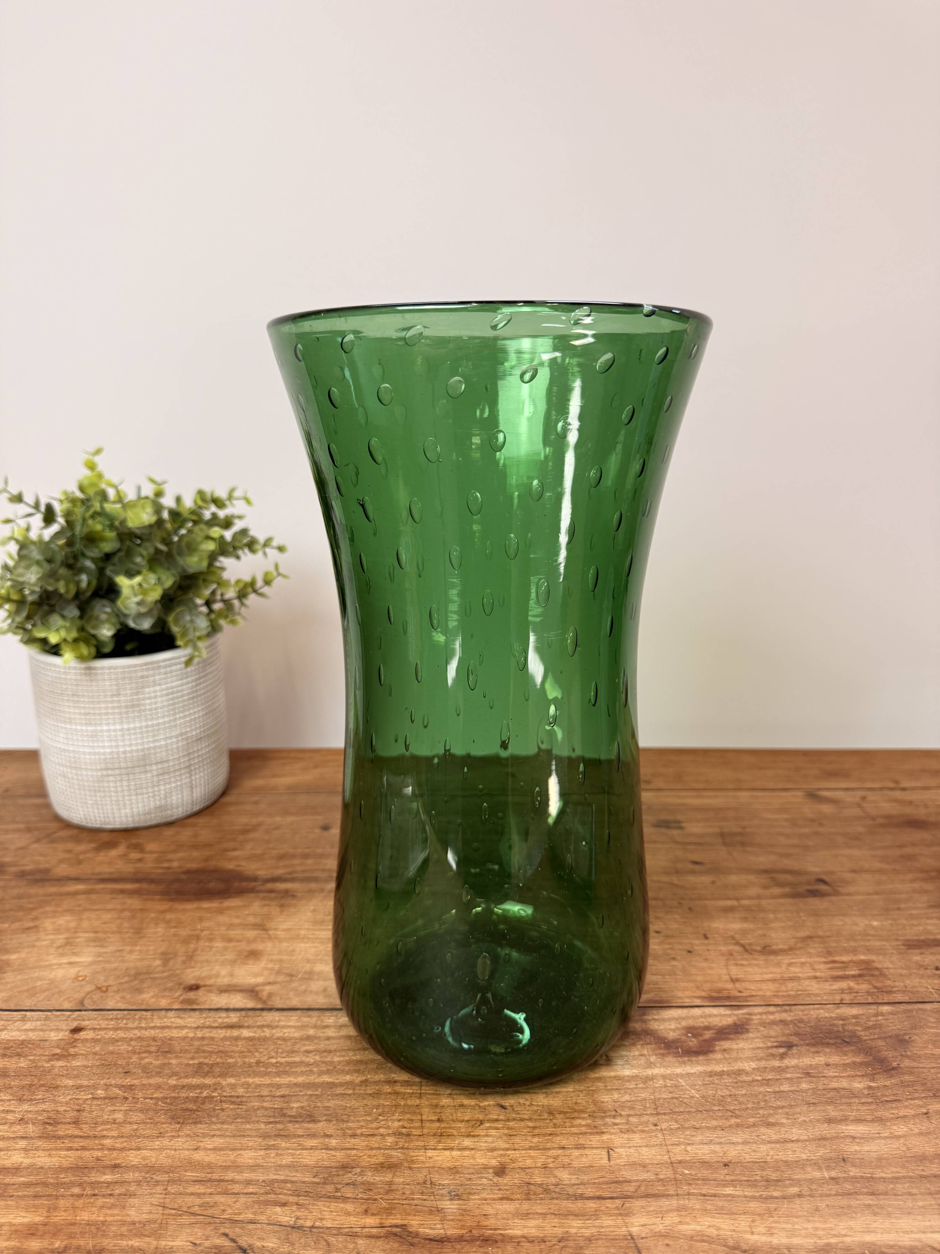Green blown glass vase with a bubble design