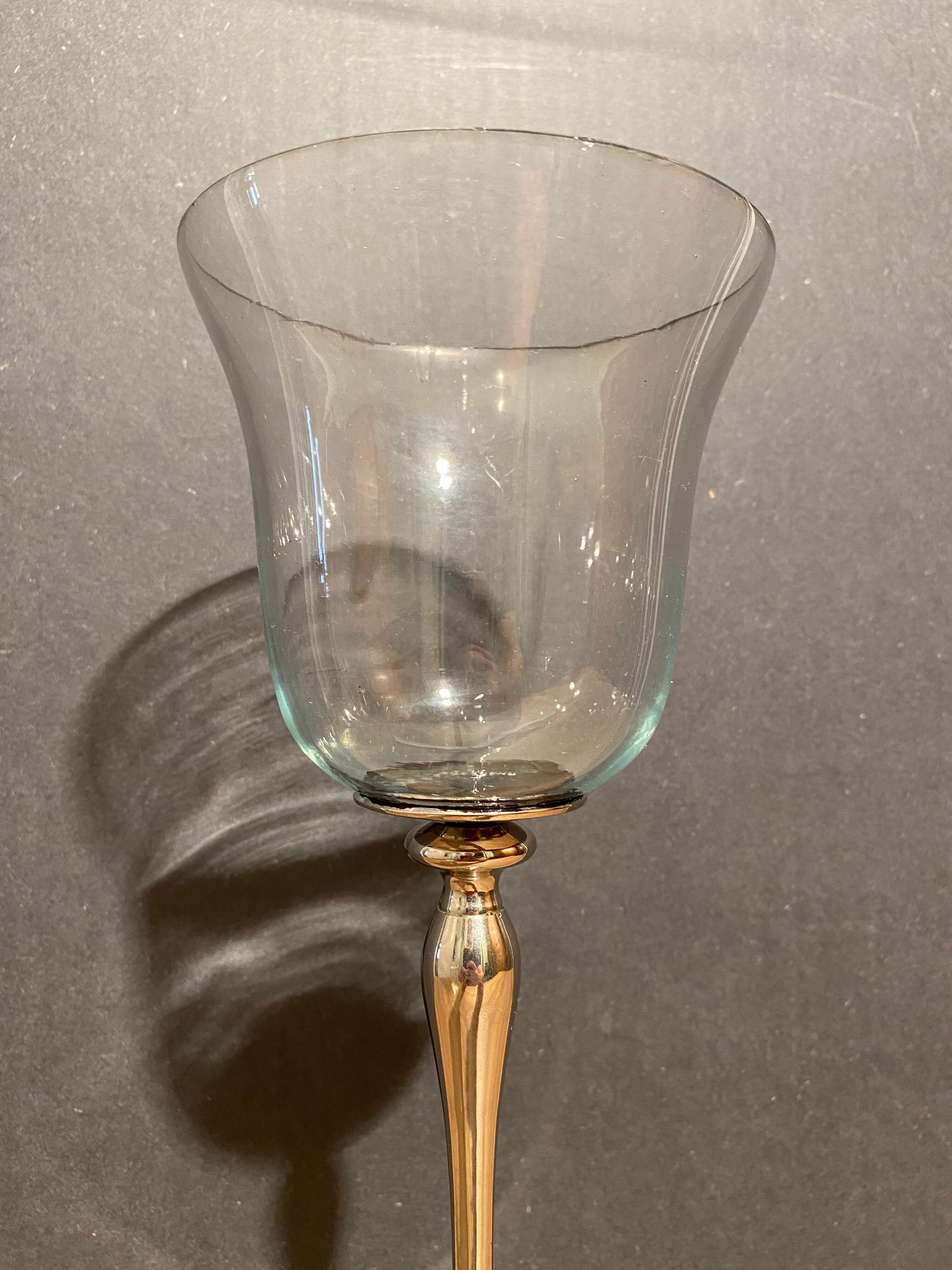 Glass photophore on high metal stand with silver patina