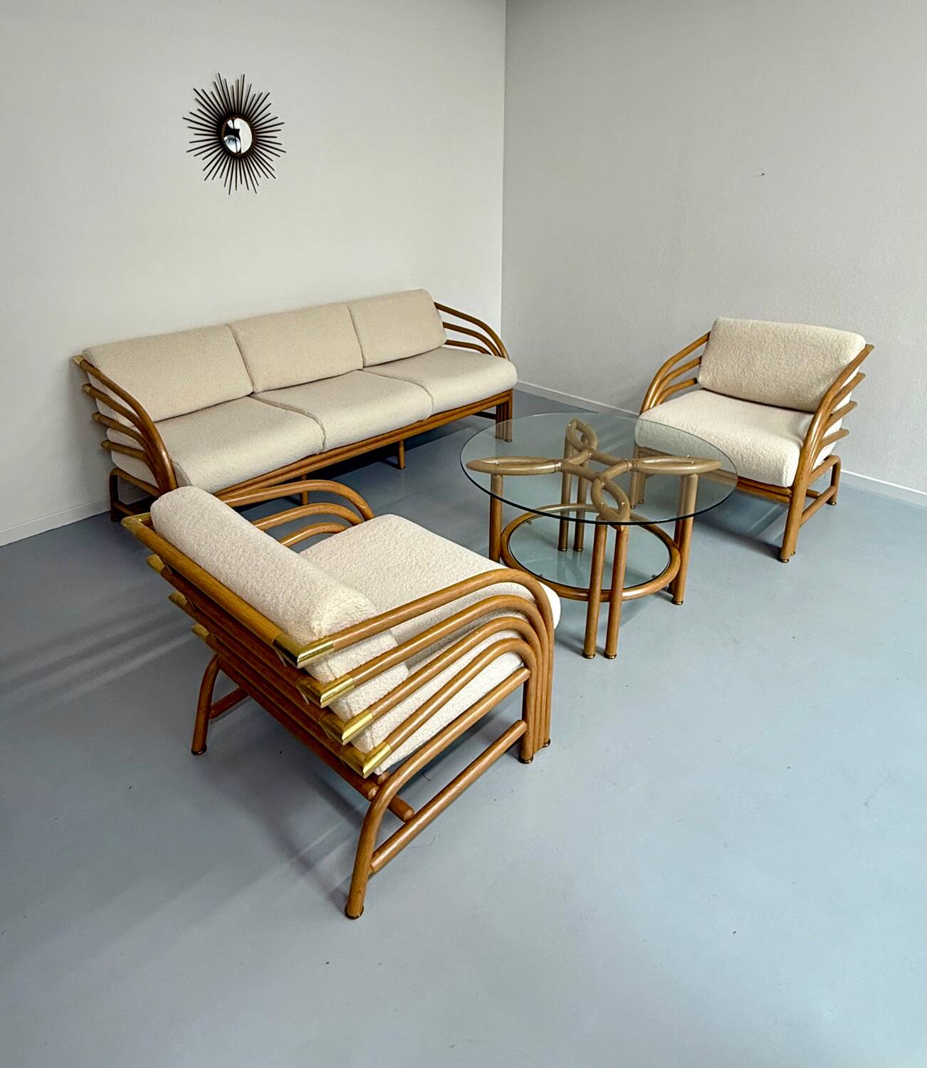 Complete living room with rattan sofa and white bouclette, brass finish, 80's design