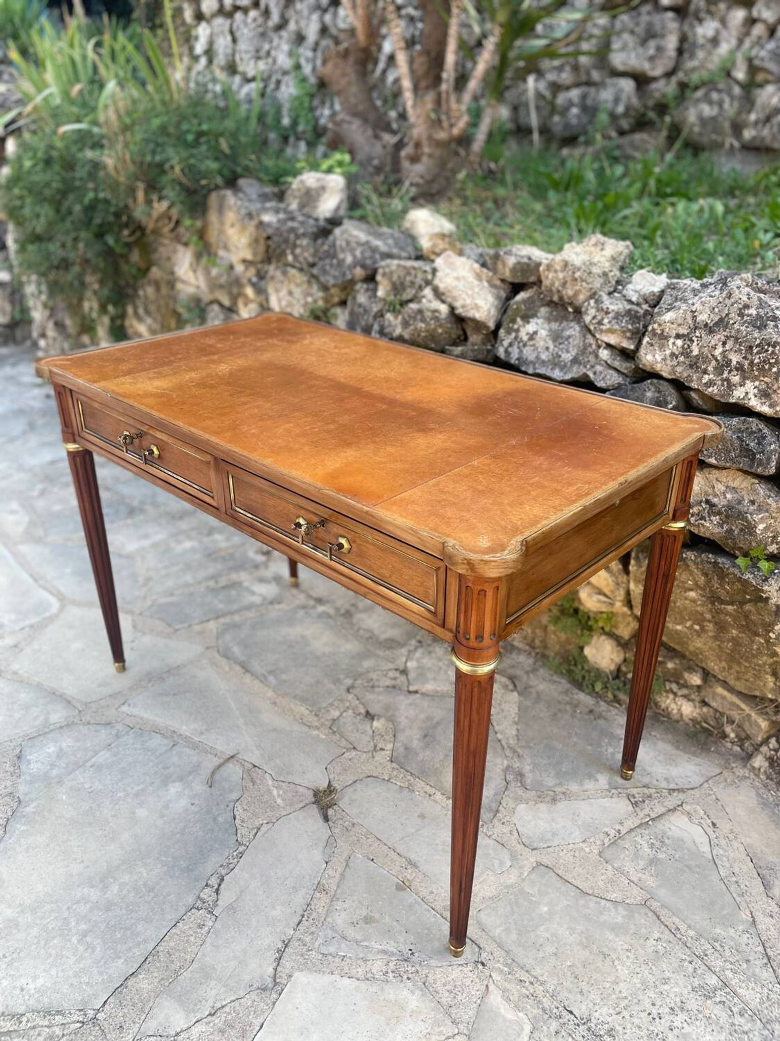 Louis XVI style mahogany flat desk from the late 19th century