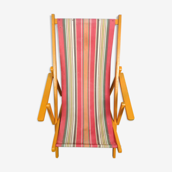 Wooden deckchair and vintage fabric