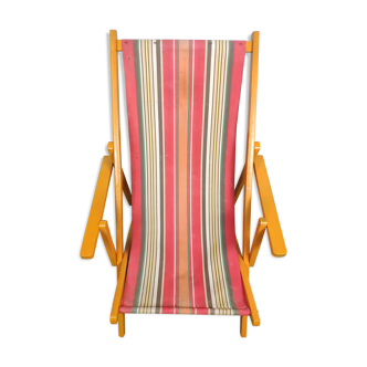 Wooden deckchair and vintage fabric