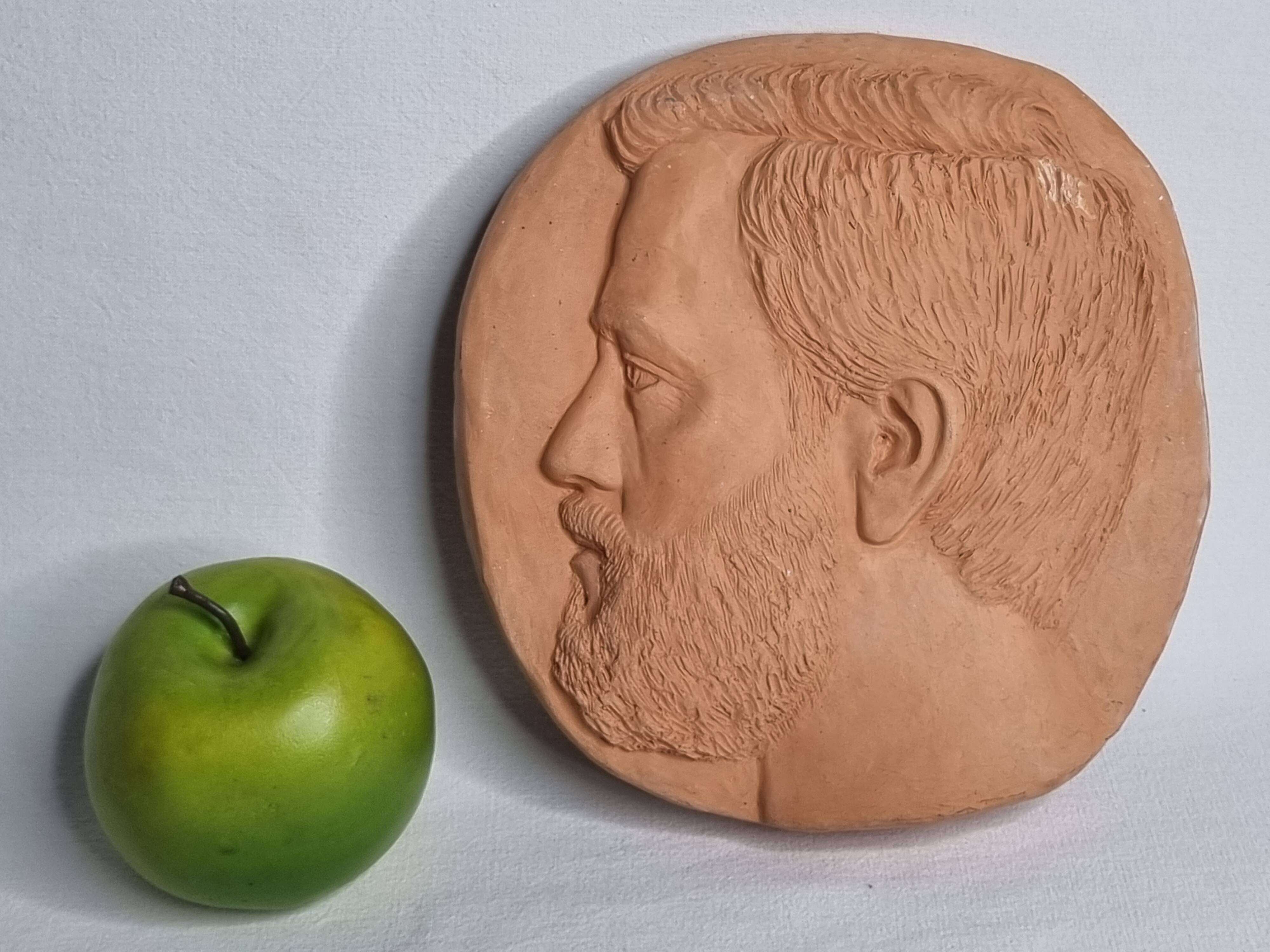 Bas-relief mural in terracotta, profile of a man, signed, 21 x 20 cm, 1984.
