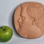Bas-relief mural in terracotta, profile of a man, signed, 21 x 20 cm, 1984.