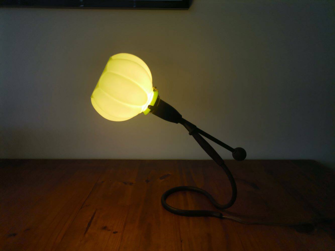 Modernist green cased glass and brass articulated table lamp