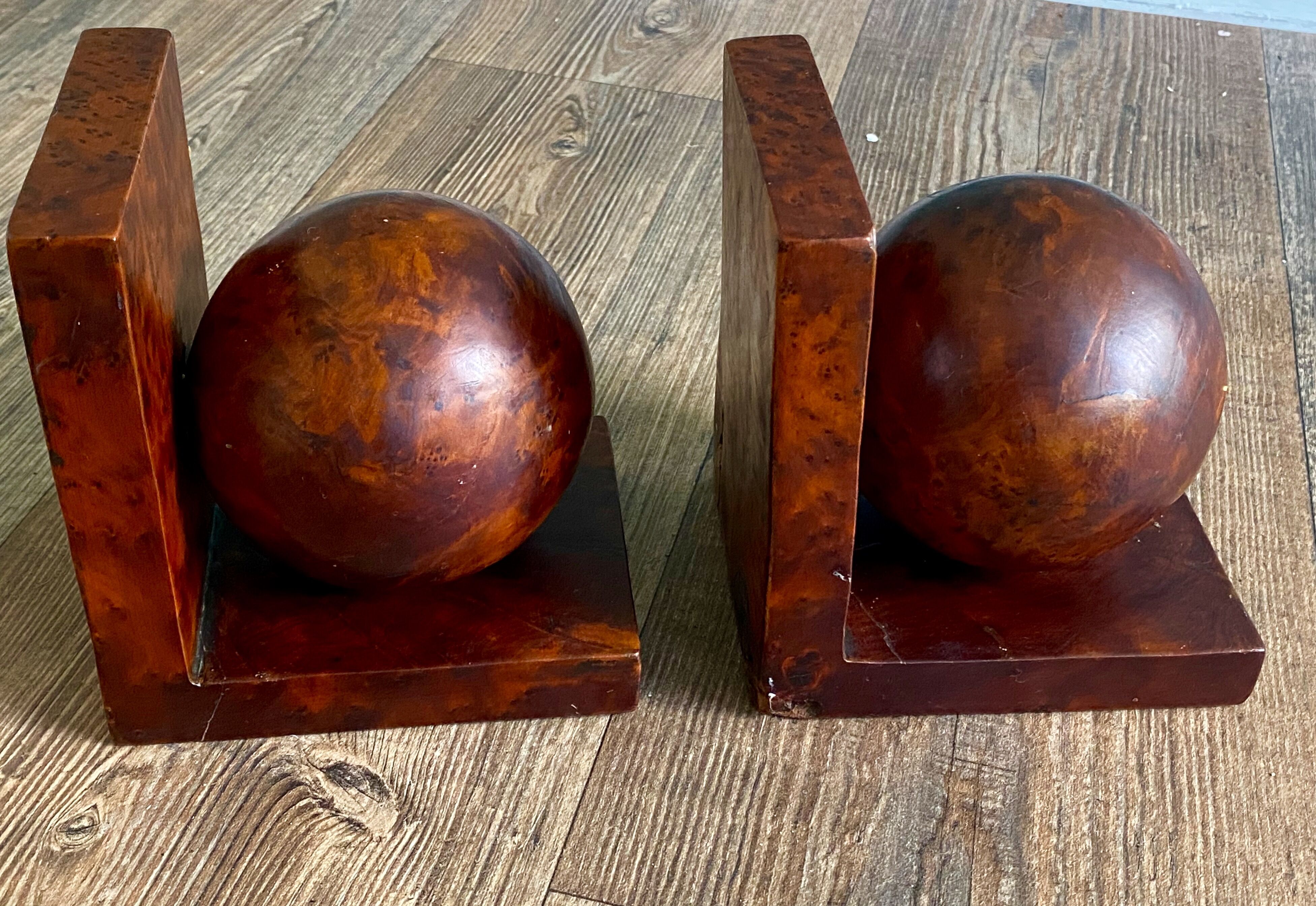Pair of bookends adorned with spheres