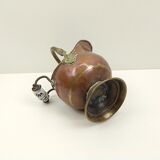 Copper pot cover and a pitcher-style brass handle