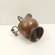 Copper pot cover and a pitcher-style brass handle