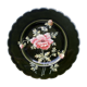 Old plate decorated with anemones or poppies on a black background