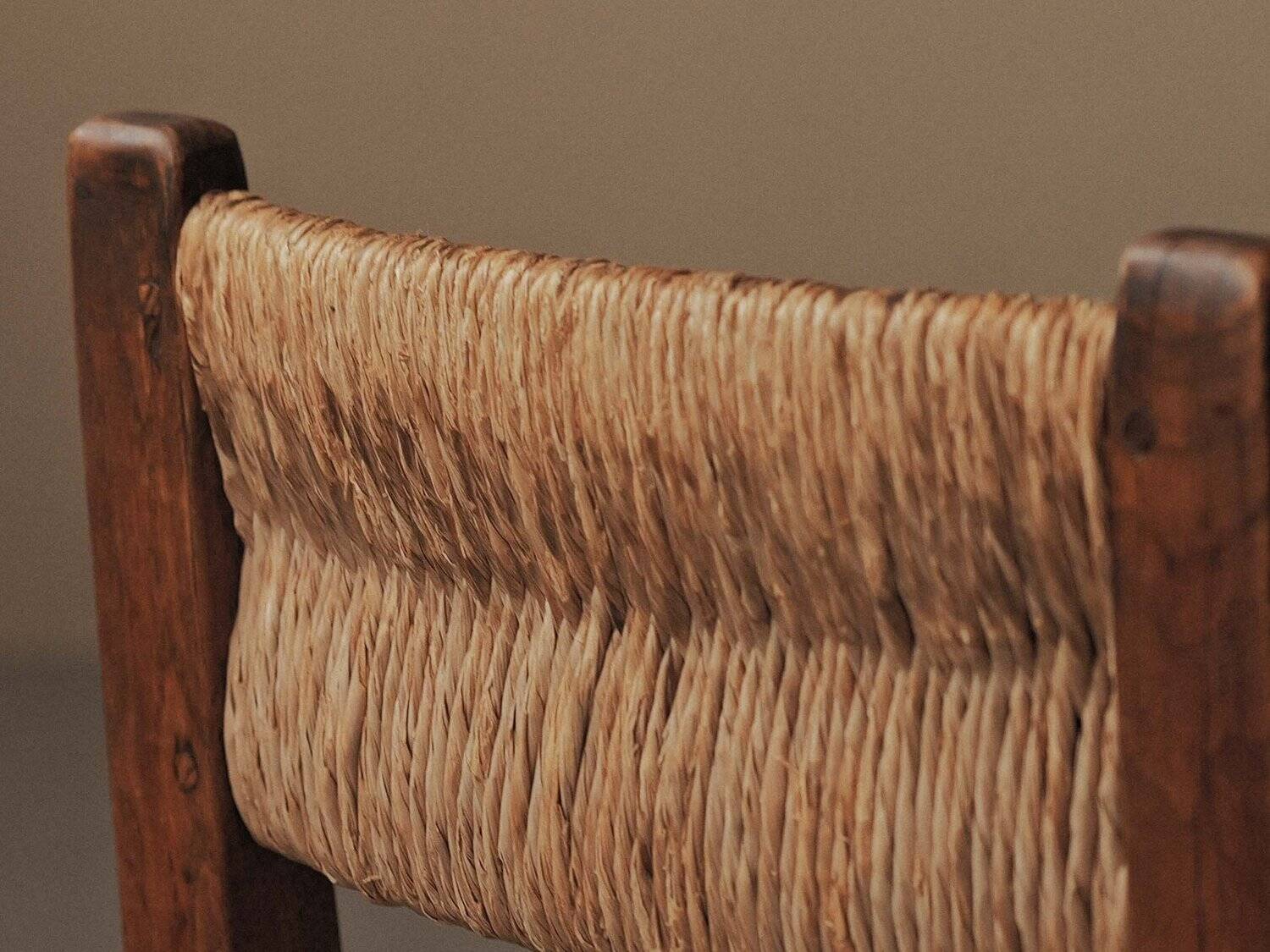 Set of four modernist chairs in oak and straw, France, circa 1960.