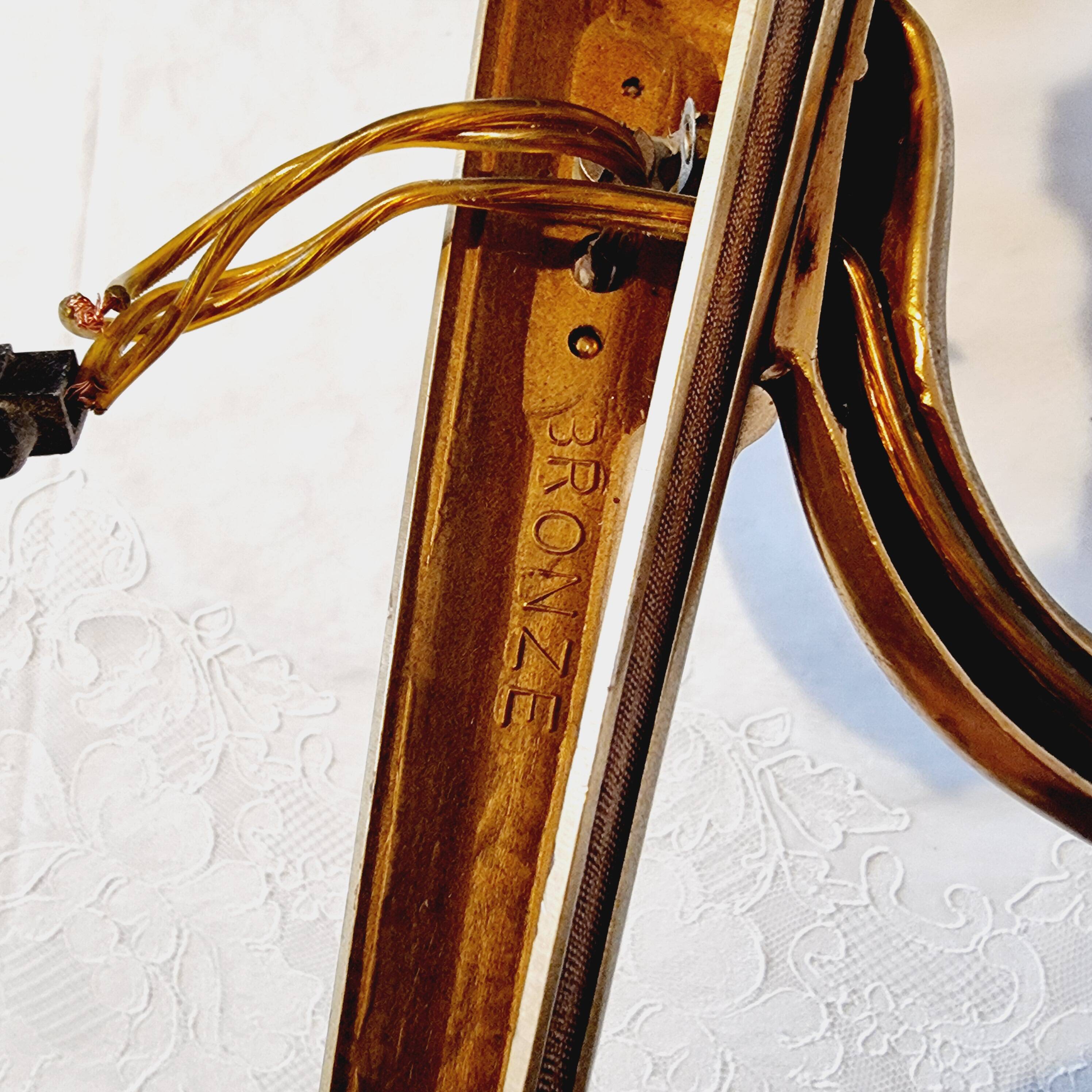 Pair of Louis XV style rocaille two-armed sconces in gilded bronze