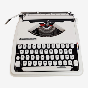Machine à écrire portative Hermes Baby ,  beige  , fonctionnelle , ruban neuf