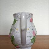 Barbotine pitcher with pastel flower decoration