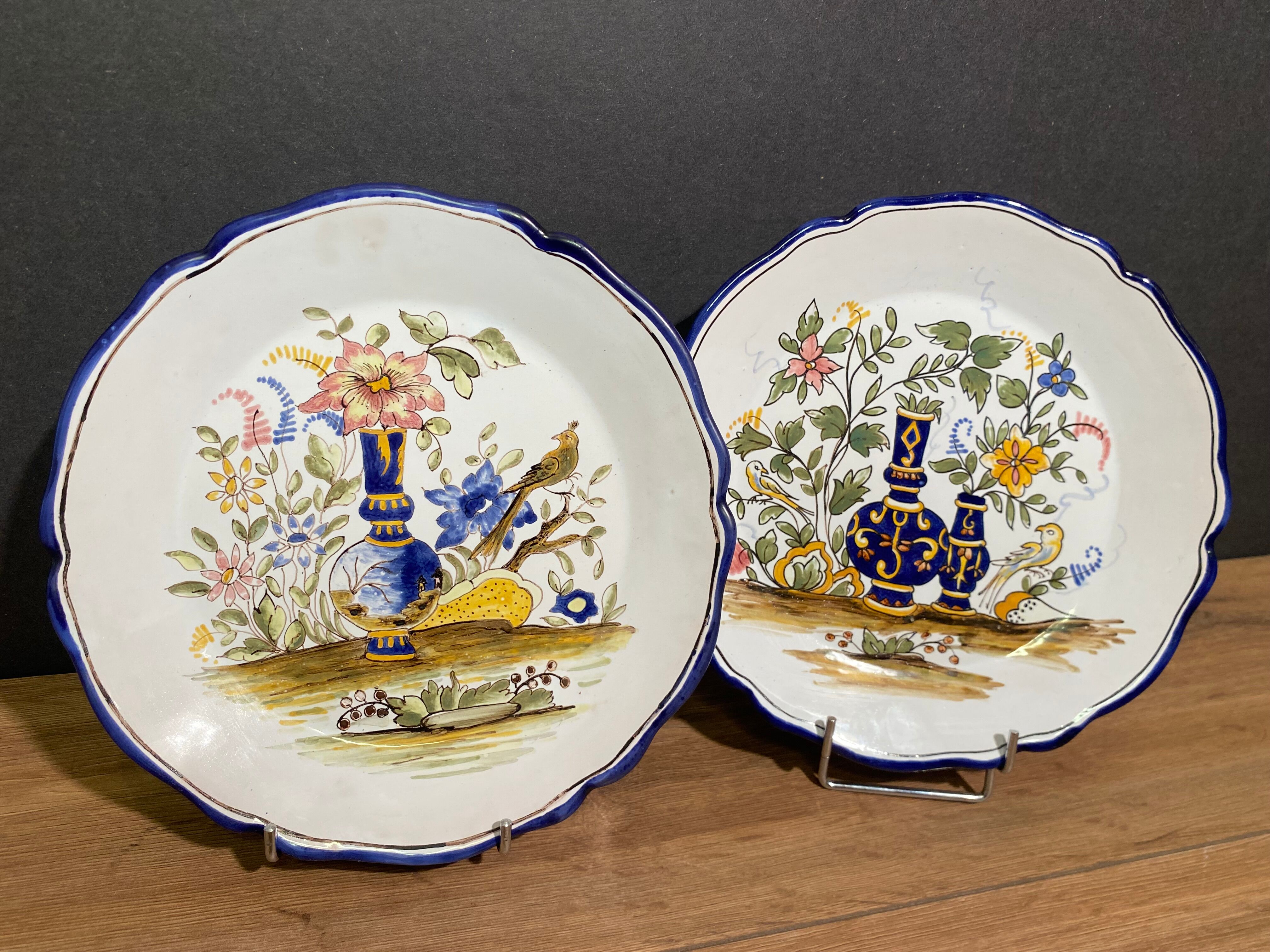 Pair of Nevers earthenware plates signed Georges
