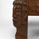 Solid oak coffee table carved with fauns and gray marble top, France, circa 1940