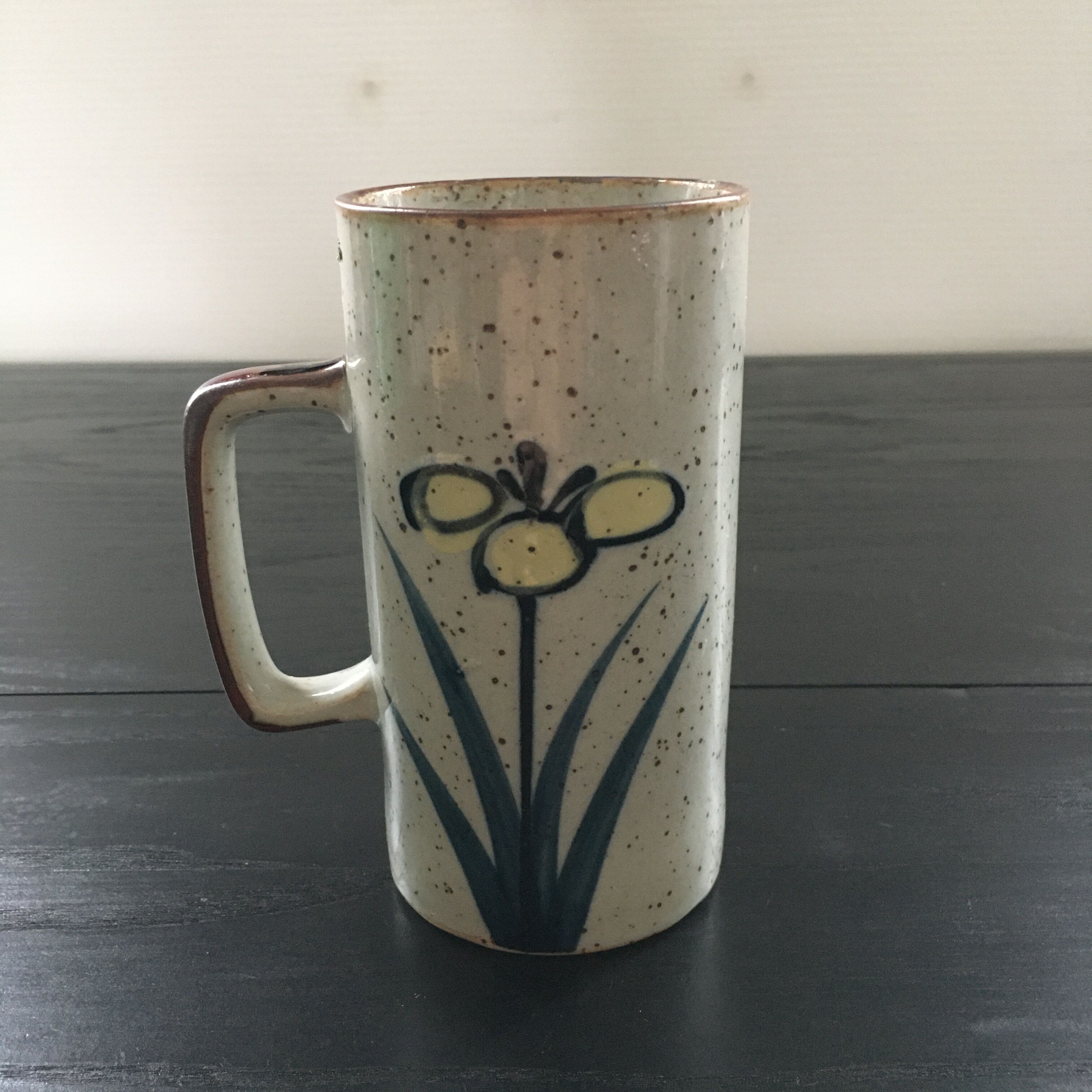 Stoneware mug with floral decoration