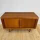 Dyrlund buffet in teak with sliding doors and interior drawers, Denmark 1960.