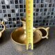 Two brass hand candle holders