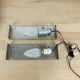 Pair of molded glass and metal wall lights from the 1950s