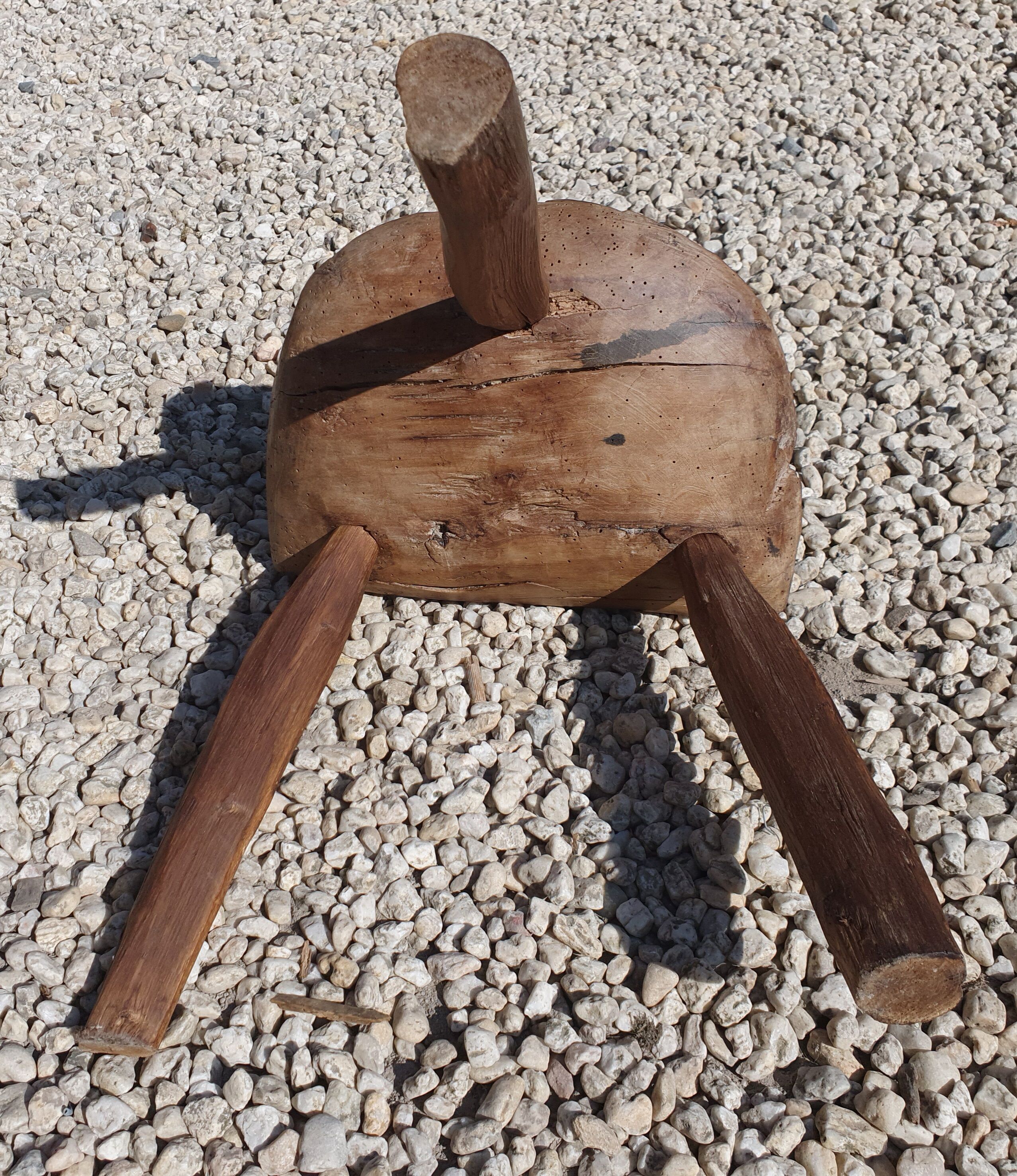 Ancient tripod milking stool