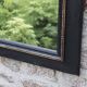 Miroir vintage en bois noir et doré à fronton – style Napoléon III