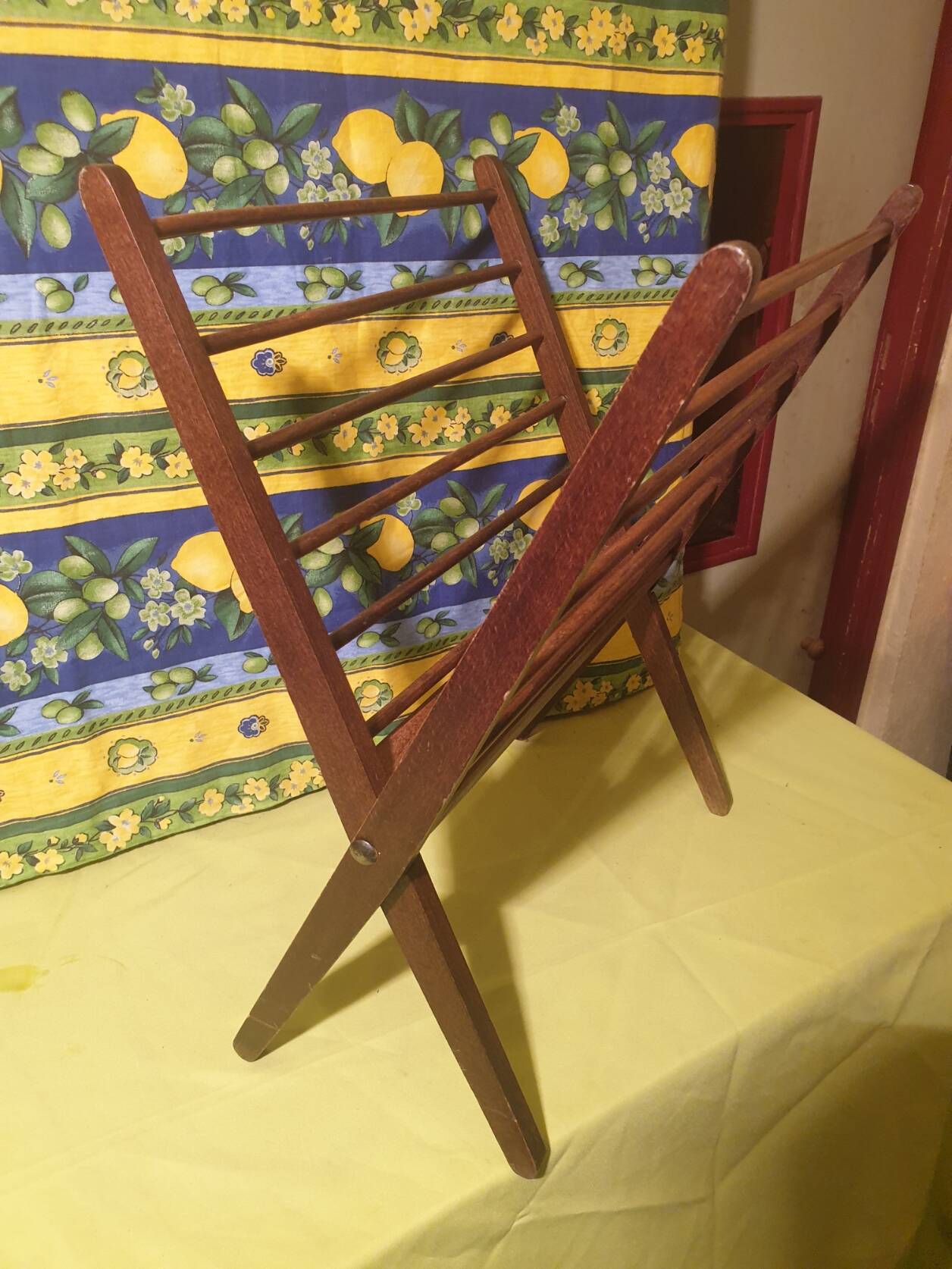 Scandinavian wooden folding magazine rack