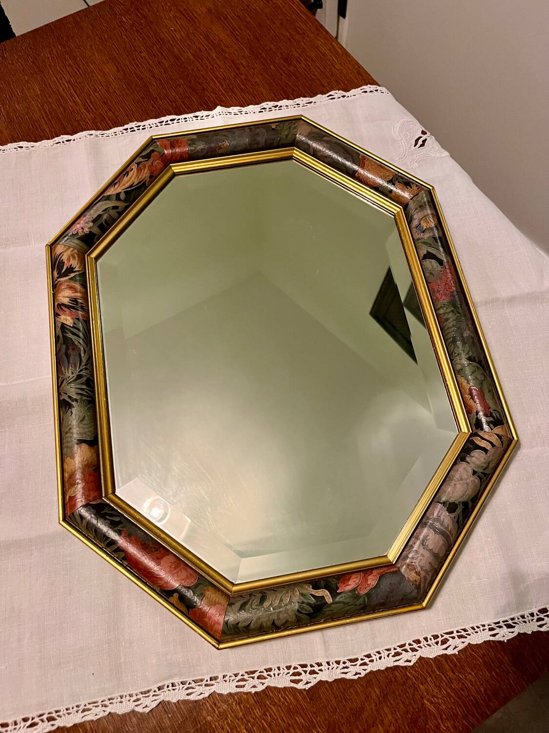 Vintage beveled mirror with floral frame