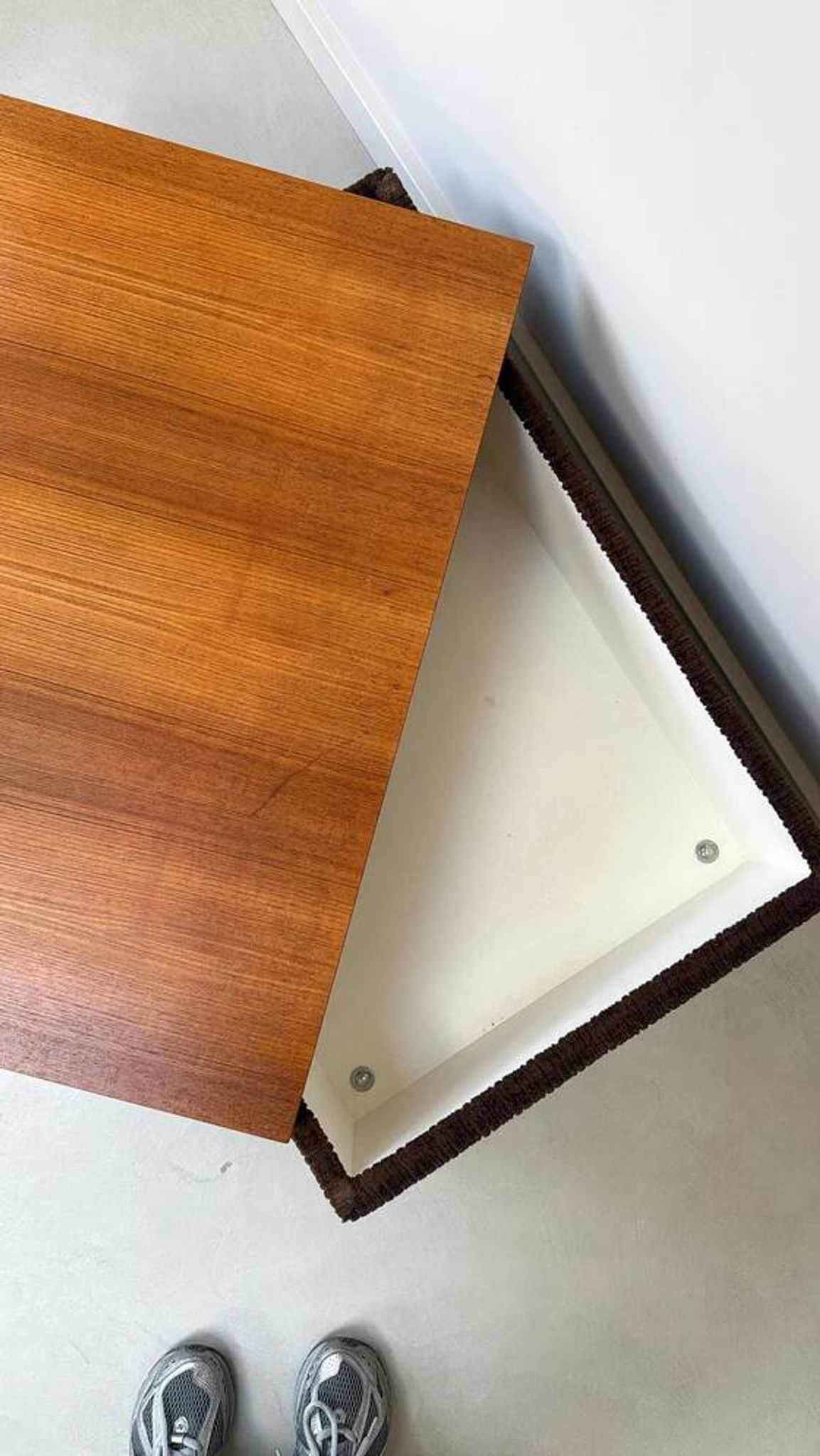 Coffee table with brown corduroy fabric, wooden top and chrome legs