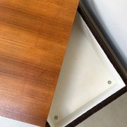 Coffee table with brown corduroy fabric, wooden top and chrome legs