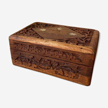 Carved wooden box with brass inlay