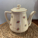 Old teapot or coffee maker in English style.