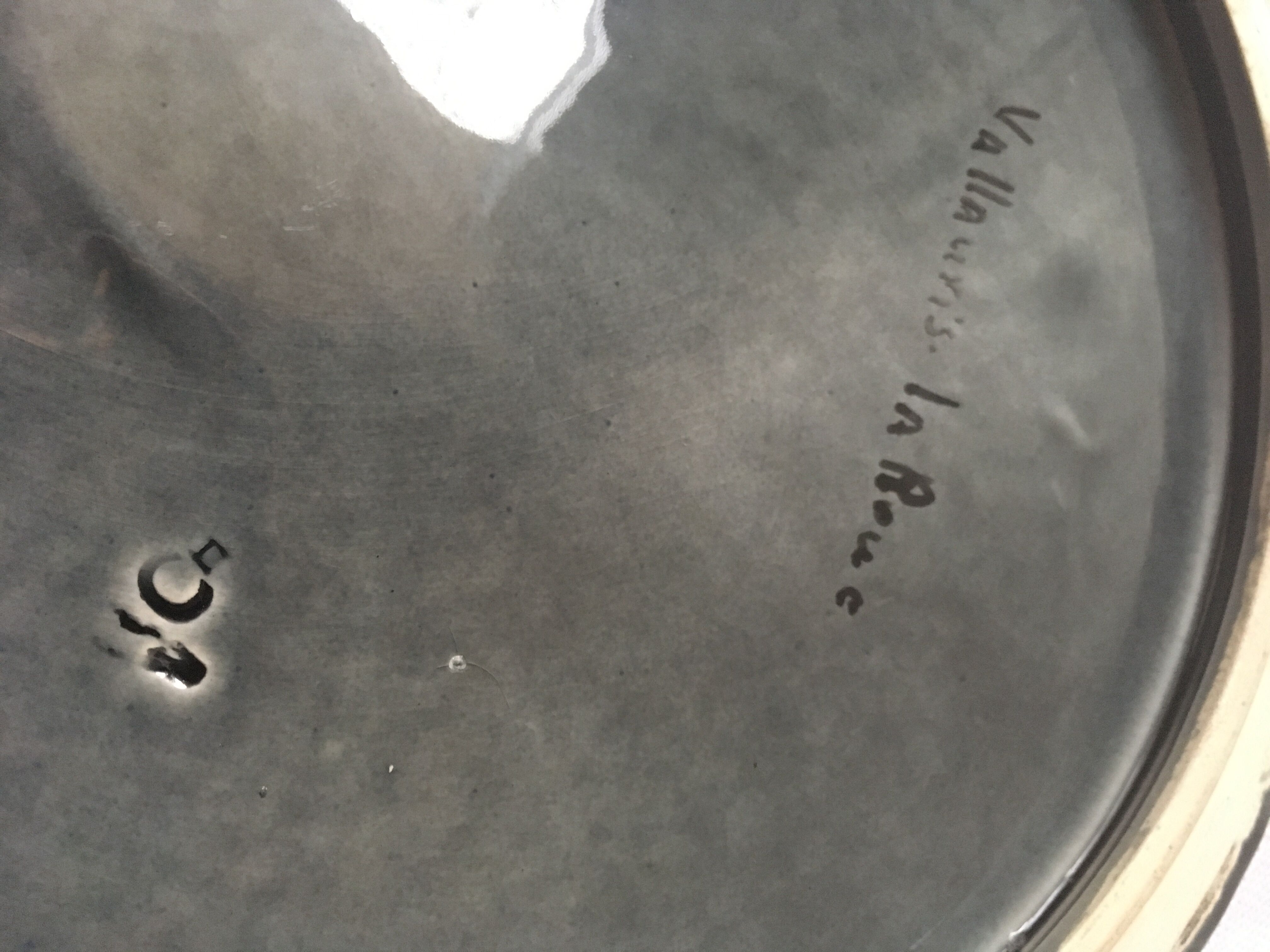 Underside of flat ceramic pink flowers La Roue de Vallauris